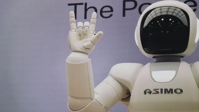 Humanoid robot and engineer working in a robotics laboratory
